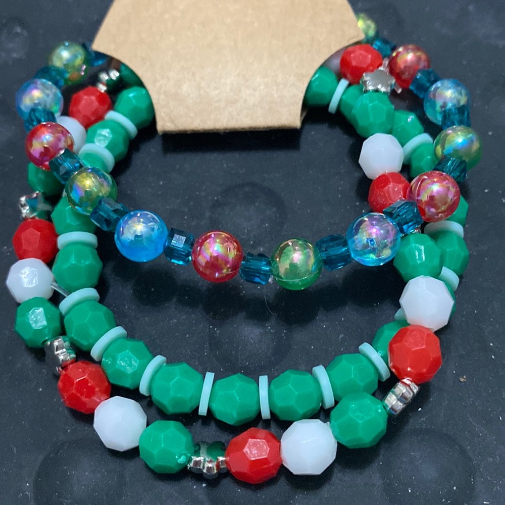 Three Christmas beaded bracelets. Red green& blue 6 1/2 inches w/ stretchiness.
